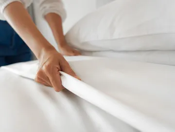 A freshly made vacation rental bed